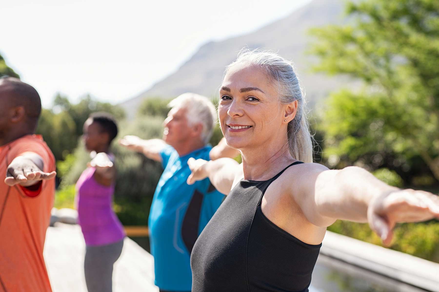 Woman with hearing loss at a yoga class